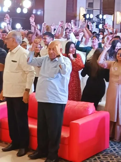 The audience at a corporate dealers' meet, fully engaged in an ice-breaking activity. I ensure that even formal events have moments of fun and interaction.