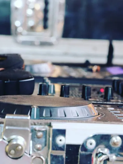 A close up shot of my workspace. This is my Pioneer DJ deck, a standard in the industry, which I use to craft the perfect mix for your party.