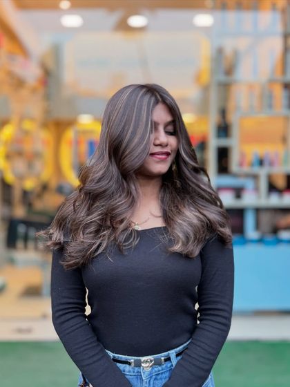 One of our best looks. This ash blonde balayage is a client favorite, featuring a seamless blend of cool tones for a sophisticated and trendy style.