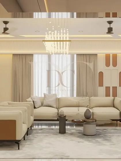 Here is a look at a spacious living room we designed, combining comfort with luxury. We used a neutral color palette with pops of olive green, a statement chandelier, and custom wall paneling to create a sophisticated yet inviting atmosphere for the family.