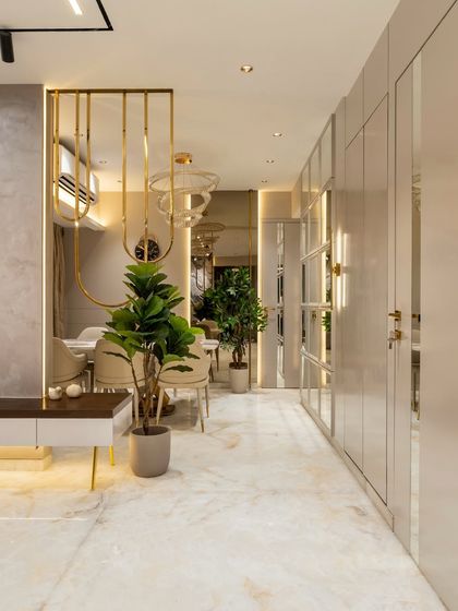 A symphony of sophistication and serenity. This contemporary dining space seamlessly blends modern design with timeless luxury, from the soft beige palette to the striking gold SS accents that frame the room like art.