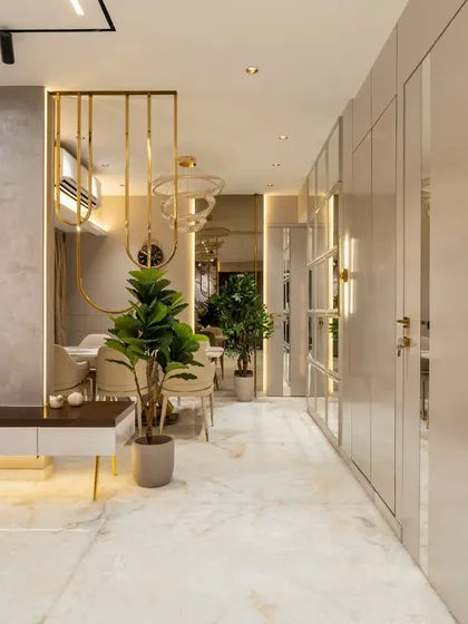 A symphony of sophistication and serenity. This contemporary dining space seamlessly blends a soft beige palette with striking gold SS accents. The textured paint walls add depth, while elegant lighting fixtures set the mood for memorable gatherings.