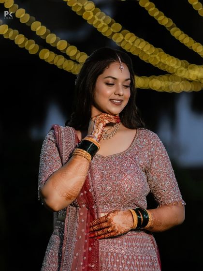 A beautiful candid photo of the bride. The minimal makeup enhances her features without feeling heavy, perfect for a long night of celebrations.