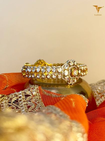 A perfect statement bangle for the woman who knows her worth. This Polki diamond bangle is pure, bold, and effortlessly timeless.