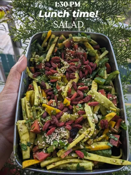 For lunch at 1:30 PM, I love a big, colorful salad. This one is packed with a variety of veggies, seeds, and goji berries, making it not just nutritious but also incredibly satisfying and full of different textures.