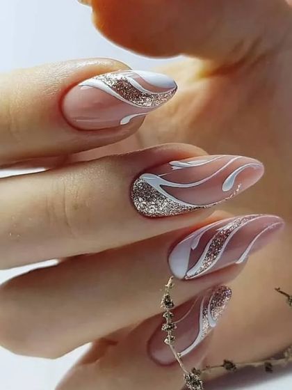 An elegant and sophisticated design with a nude base, white swirls, and sparkling silver glitter accents.