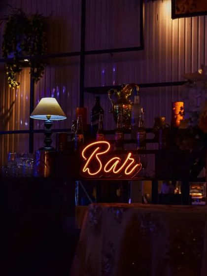 A simple yet elegant bar sign. Even a small, well-placed neon sign can transform a space and clearly designate the party's most popular spot.