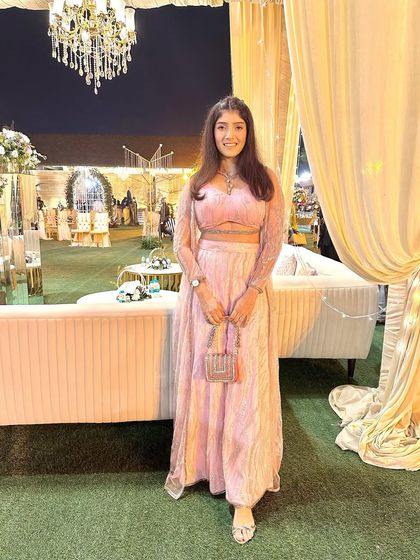 Attending a wedding in a beautiful pink co-ord set. The delicate necklace adds the perfect touch of sparkle to this elegant evening look.