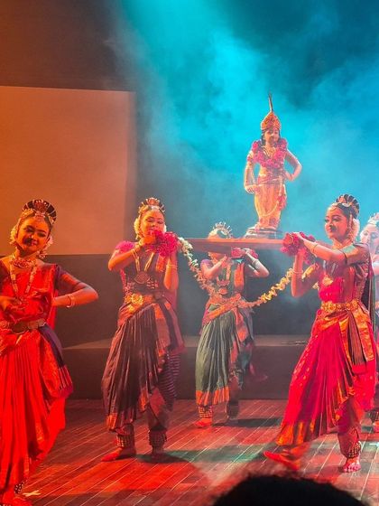 The festive procession of Lord Krishna's idol during our stage production. This scene is filled with color, joy, and devotion, engaging the audience in a celebratory mood.