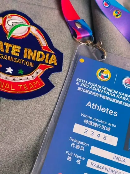 The details of a champion. My official athlete credentials and the Karate India National Team patch on my blazer for the Asian Championship.