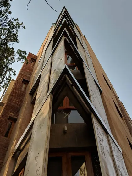 This is a close-up of the movable perforated metal screens on our Defence Colony residence. The design allows them to slide, giving residents control over sunlight and privacy. This is a modern interpretation of the traditional jaali, a key element of passive cooling design.