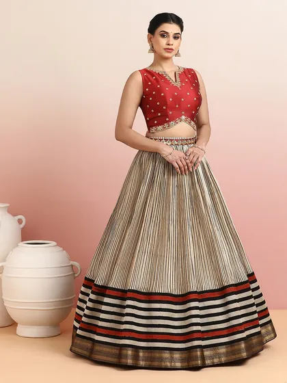 The full view of the striped lehenga, showcasing its unique pattern and modern silhouette.