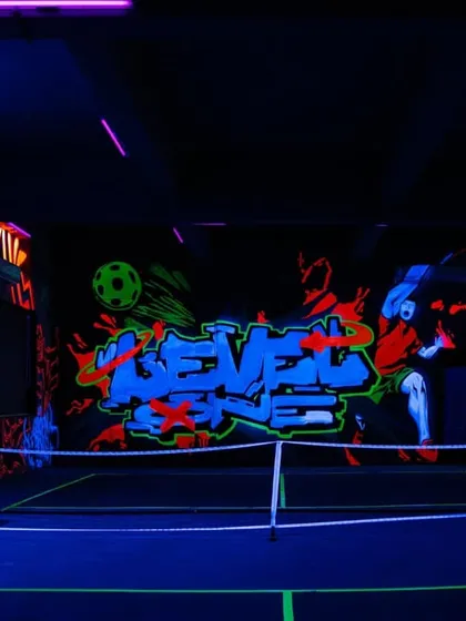 This is Mumbai’s first glow-in-the-dark mural on a pickleball court, a project for Level One Arena. I used special UV paints to create a dynamic, high-energy space that completely transforms under blacklight, perfect for an immersive gaming and sports experience.