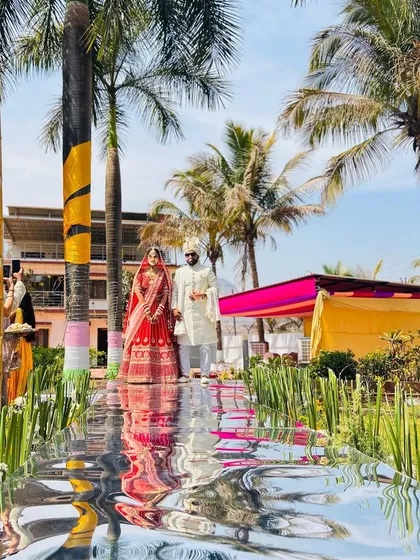 The Varmala moment is one of the most iconic parts of a wedding. I created this mirrored aisle that beautifully reflected the couple and the sky, making their exchange of garlands even more spectacular.