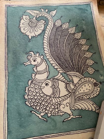 The artwork comes to life with the application of a background wash. This traditional technique, done with natural dyes, gives the piece an authentic, aged look.