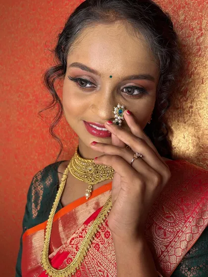 A playful pose with the nath, adding a touch of Maharashtrian tradition to the look.