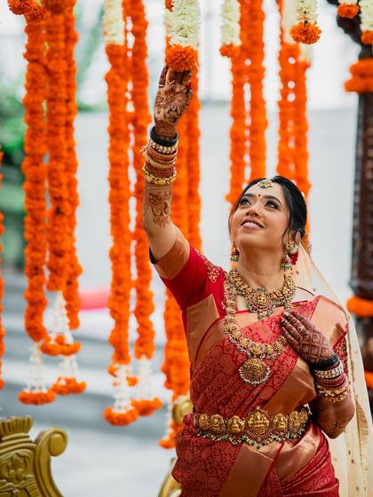 Another lovely shot with the marigold decor, her makeup looking perfect.