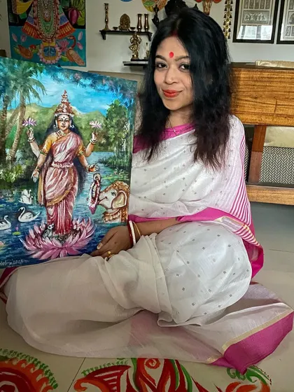 Me with my acrylic painting of Goddess Lakshmi, created for the Kojagori Lokkhi Puja. The traditional imagery and vibrant colors are meant to bring blessings and prosperity.