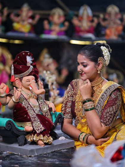 A moment of devotion, dressed in a beautiful yellow Nauvari, ready for the Ganpati festival.