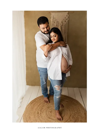 An intimate embrace between partners in a casual, relaxed setting. This is what real love looks like.