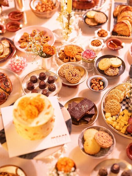 An abundant Diwali grazing table filled with our entire festive collection. We love creating these spreads that invite guests to gather, share, and indulge in a variety of sweet and savory treats.