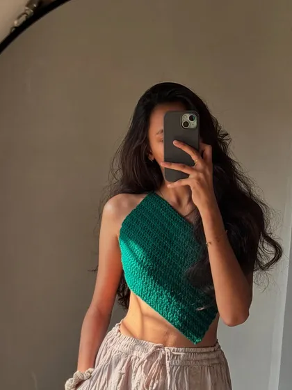 This handmade crochet top is definitely a statement piece. The sharp, angular cut of this asymmetrical design is for days when you feel bold.