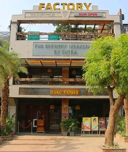 The entrance to a commercial establishment sets the first impression. For this pub in Gurgaon, I used large palm trees and other greenery to create an inviting, resort-like atmosphere that draws customers in.