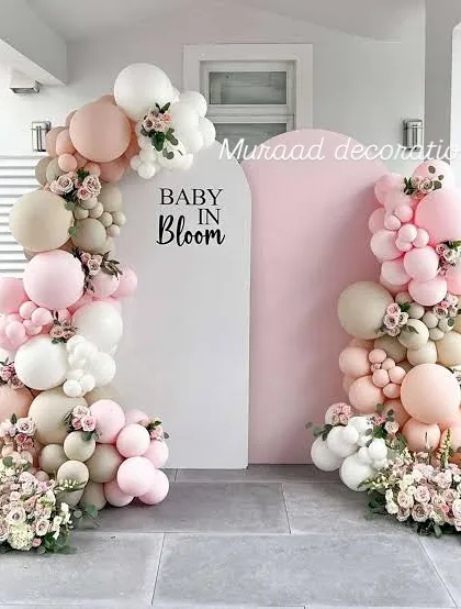 For a soft and elegant baby shower, the 'Baby in Bloom' theme is a beautiful choice. I combine blush, white, and cream balloons with delicate floral arrangements to create a sophisticated and welcoming atmosphere for the mom-to-be.