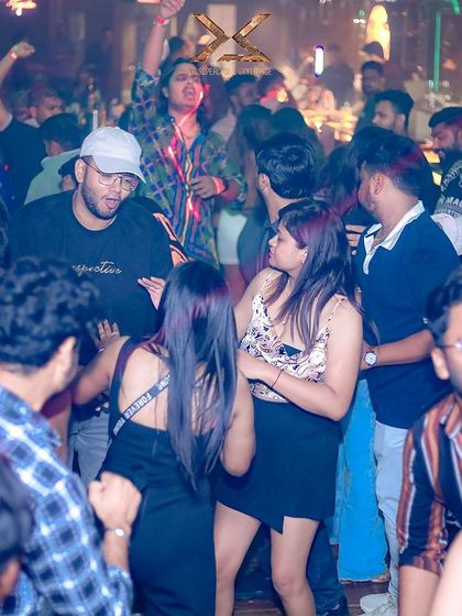 People dancing and socializing at XS Superclub.
