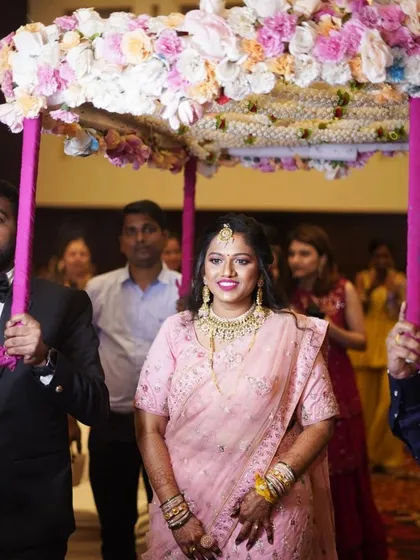 The grand entrance. This bride looks radiant and confident as she enters her engagement ceremony, with her makeup looking flawless.
