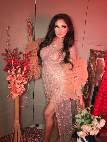 A full-length shot of the "Oh Meri Laila" look, showcasing the dramatic ruffled sleeves and the sleek silhouette of the gown.