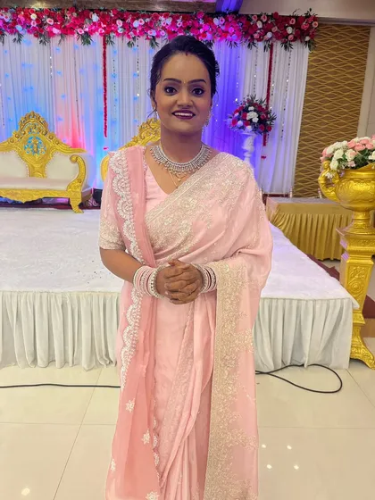 The complete reception look, with the bride looking graceful and elegant.