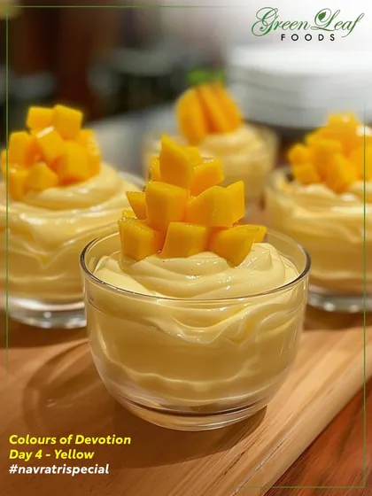 Celebrating the color yellow for Navratri with this delightful mango dessert. A creamy, smooth mango mousse topped with fresh, juicy mango cubes, served in individual glass cups for an elegant presentation.