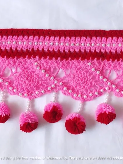 This pink and red toran with pearl details is a beautiful example of a custom piece made with love.