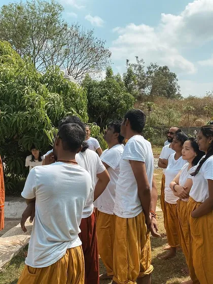 I lead a group of students in an outdoor discussion. Learning at the ashram happens everywhere, not just inside the yoga shala.