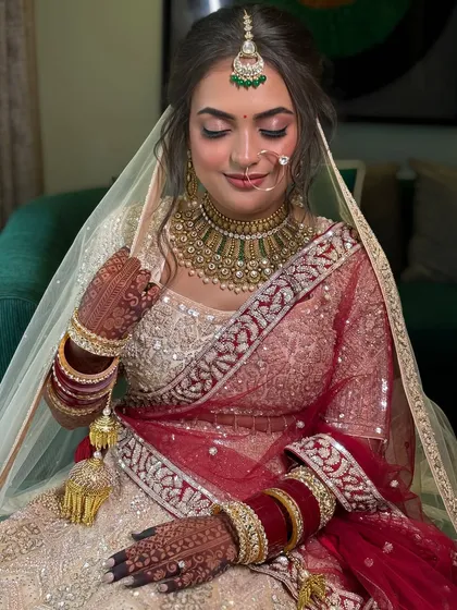 The final look, with the veil perfectly placed over the elegant updo. This hairstyle is perfect for a traditional yet modern bride.