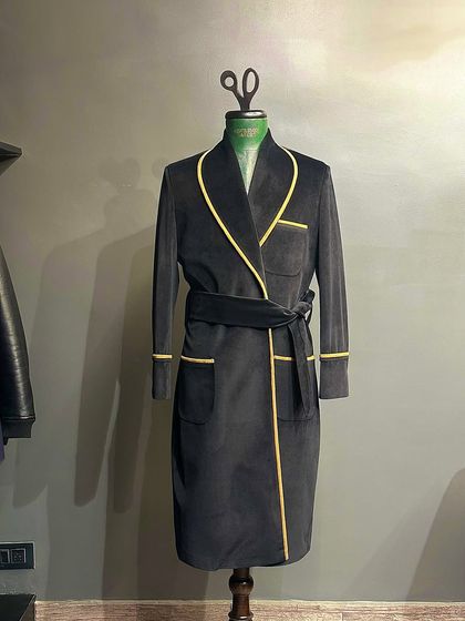 Our customized smoking jacket in black velvet with contrasting yellow piping. This is the epitome of old-money luxury and refined loungewear.