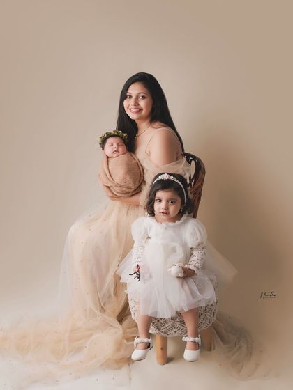 A beautiful portrait of a mother and her two daughters, one a newborn. Capturing multiple generations is so special.