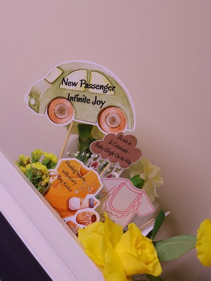 More custom decorative picks for the baby shower, with messages like "New Passenger, Infinite Joy." These small, personalized details are what make my events so special.