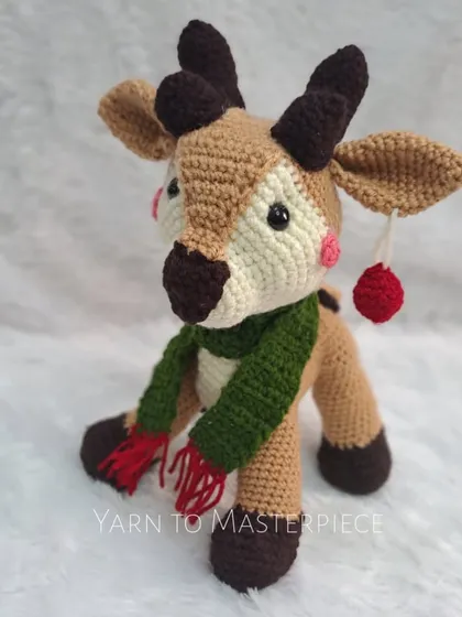 The reindeer amigurumi is ready to guide Santa's sleigh! It's a wonderful, handmade addition to your holiday collection.