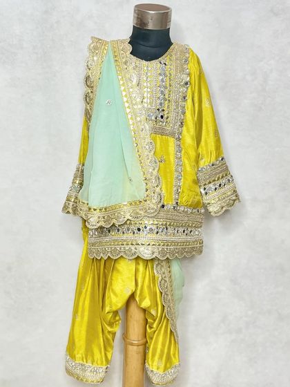 Another angle of the traditional yellow kurta set, a truly dazzling piece.