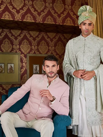 Here, the groom in the light green sherwani is complemented by a guest in a pink bandhgala, showcasing how I coordinate colors and styles for the entire wedding party.