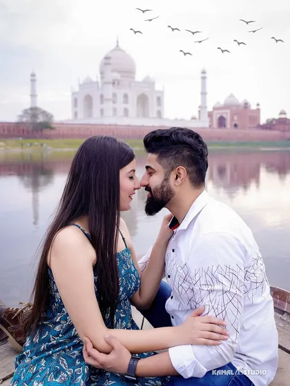 A tender moment shared on a boat, with the iconic silhouette of the Taj Mahal creating a dreamy and romantic backdrop.