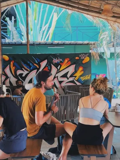 The finished graffiti mural at the jungle cafe in Goa. The piece serves as a central artwork, adding an urban edge to the rustic, open-air setting.