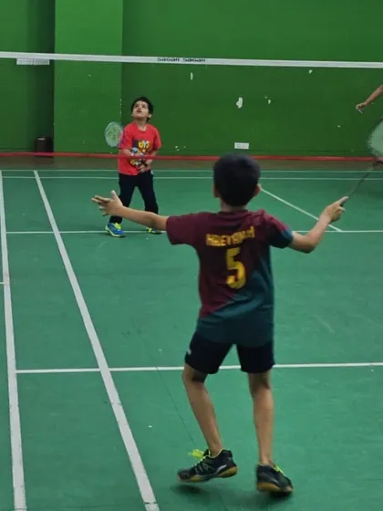 It's always a great day when the kids take over the court. Here you can see our junior players learning the game, full of excitement and ready to hit the shuttlecock. We provide a safe and fun space for children to develop their badminton skills and find their passion for the sport.