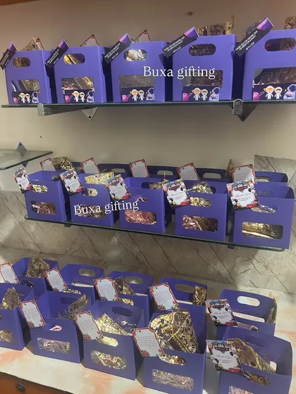 A full view of the budget-friendly purple hampers on display, showing how beautiful affordable gifting can be.