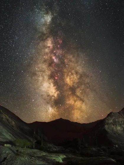 The Milky Way over the "moonscape" of Lamayuru in Ladakh. The ancient monastery and unique geological formations provide a dramatic foreground for the galactic core.
