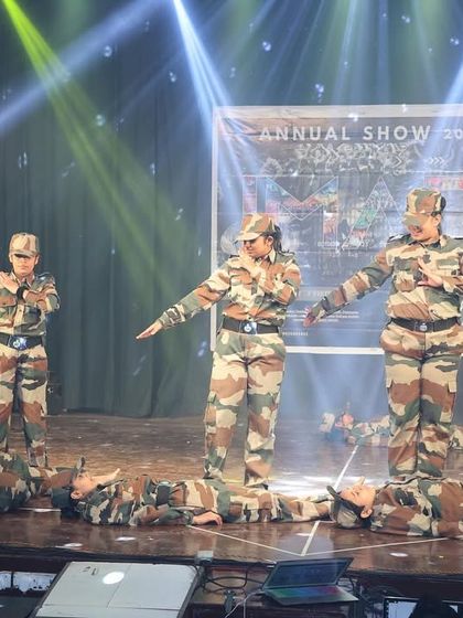 This scene from our army tribute act tells a story of sacrifice and courage. The choreography is designed to be expressive and emotionally impactful.