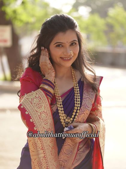 A beautiful shot showcasing the soft curls and half-up hairstyle I created for this engagement look, perfectly complementing the traditional attire.