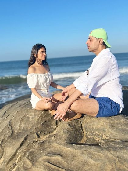 We've realized life is short, so it's important to cherish the small moments. Sitting heart to heart with my husband, meditating together on a rock by the sea, is one of those moments.